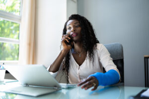 Broken Arm Injured Worker Compensation Coverage. Using Office Laptop