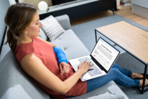 Broken Arm Injured Worker Compensation Coverage. Using Laptop